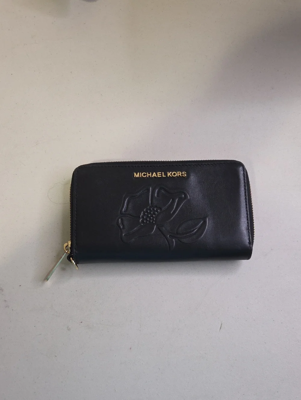 Michael Kors Black Leather Zip-Around Wallet with Floral Emboss and Gold Logo